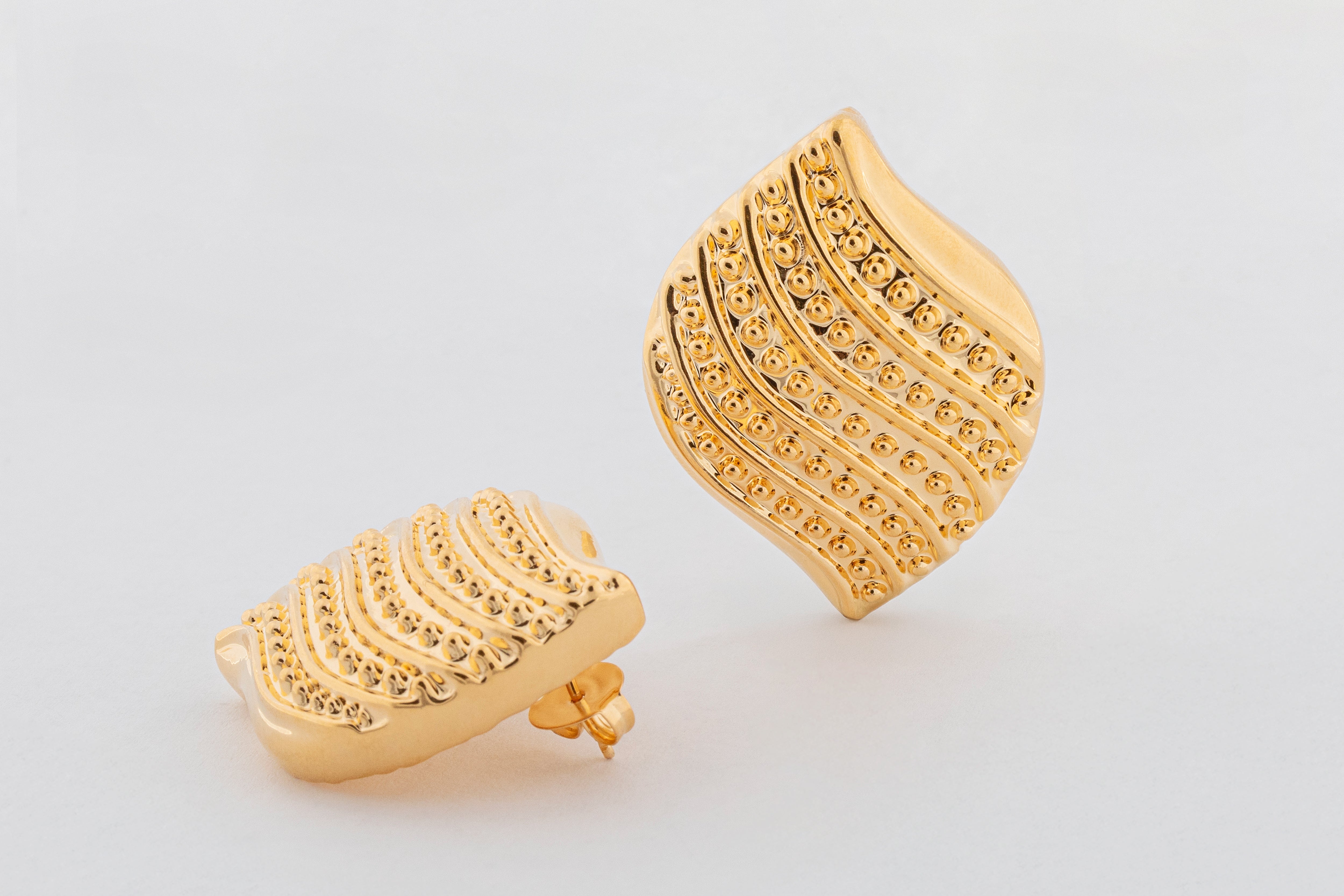 Gold plated wavy bead textured earrings with sculptural rounded design and polished finish, 42mm by 31mm