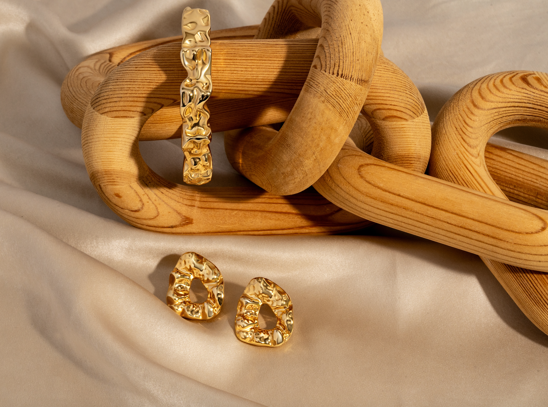 Sculptural hammered earrings available in gold plated and rhodium plated finishes with organic texture