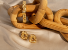 Sculptural hammered earrings available in gold plated and rhodium plated finishes with organic texture