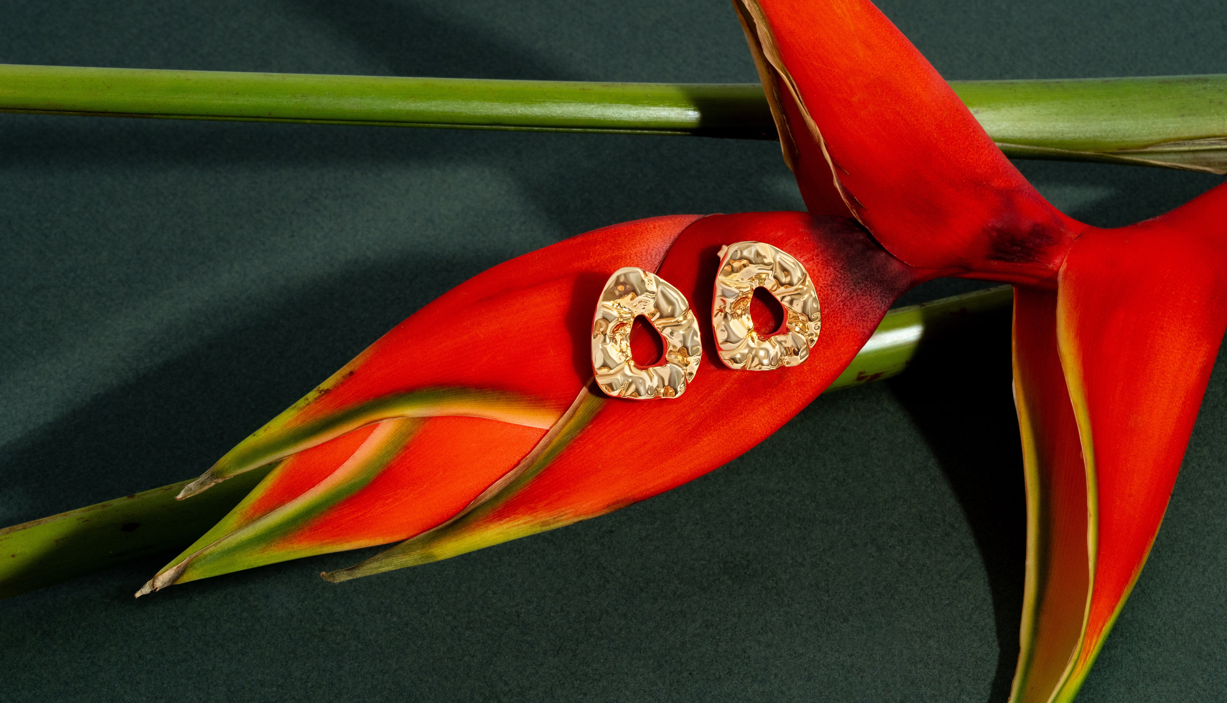 Sculptural hammered earrings available in gold plated and rhodium plated finishes with organic texture