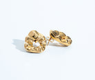 Sculptural hammered earrings available in gold plated and rhodium plated finishes with organic texture