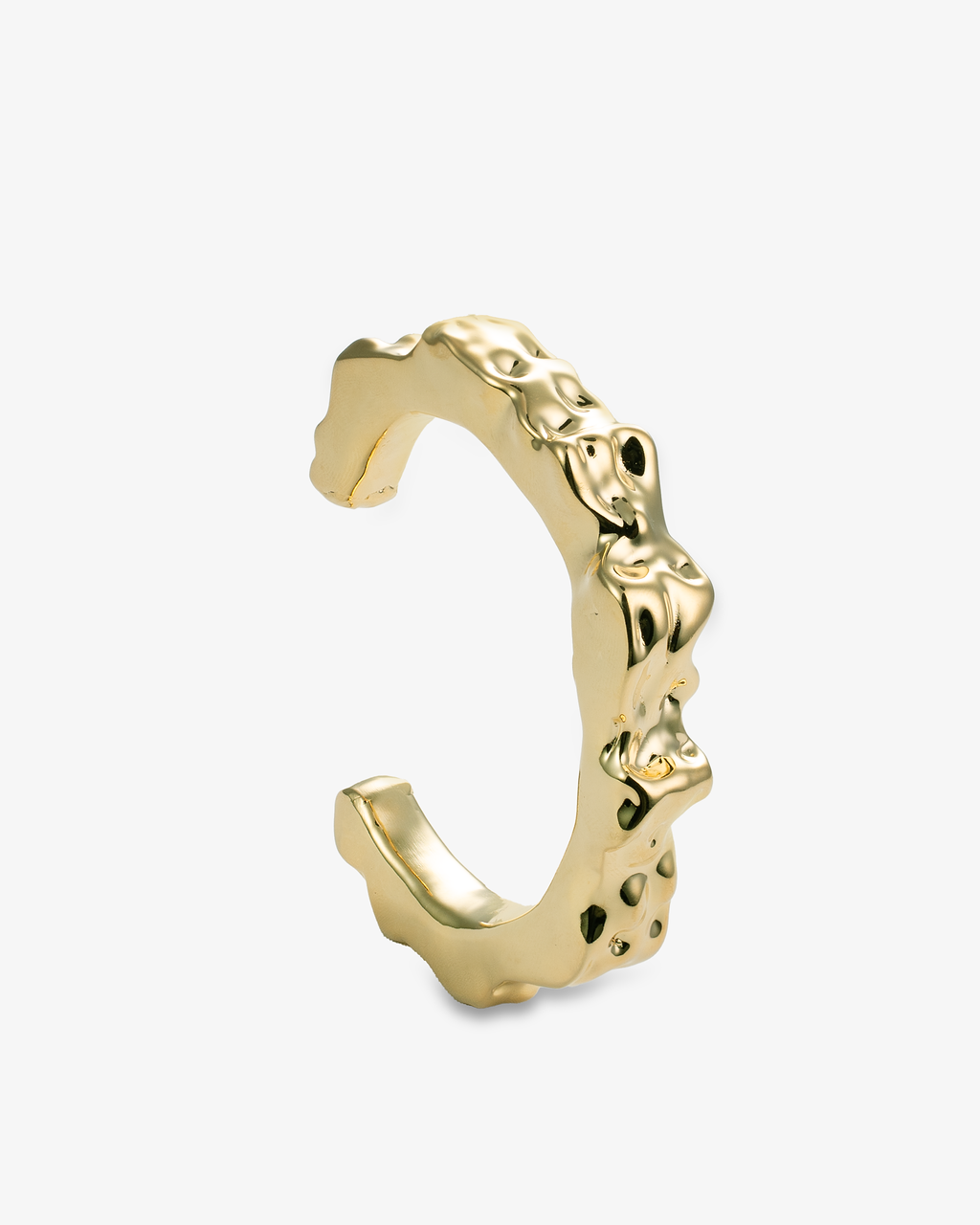 Sculptural gold cuff bracelet with irregular hammered texture side view