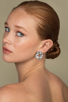 a model wearing a Hammered organic silver statement earrings