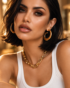 Chunky sculptural gold spiral hoop earrings