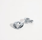 Dome earrings available in gold plated and rhodium plated finishes with smooth sculptural design