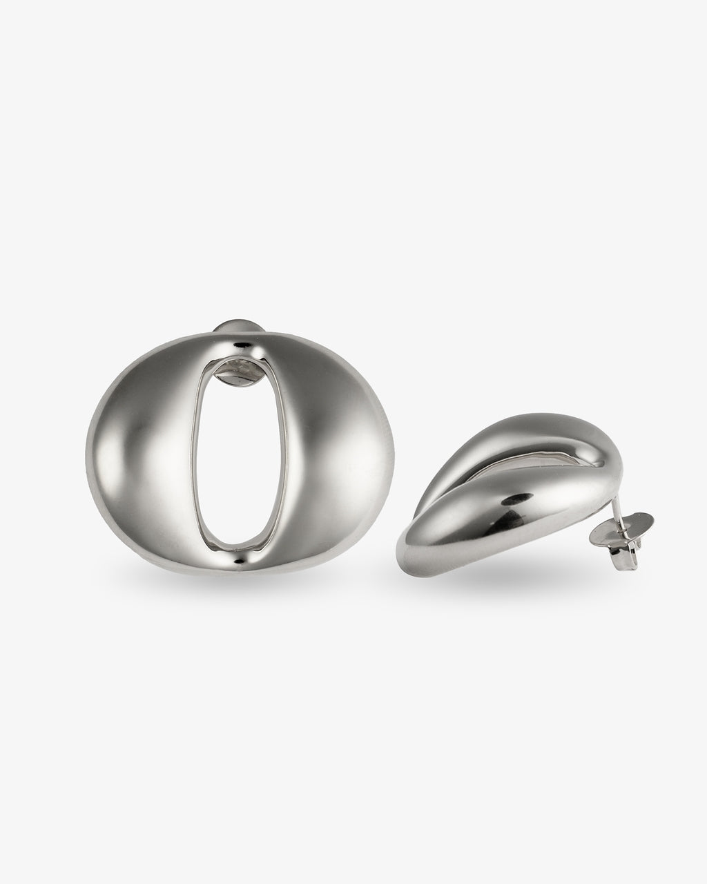 Sculptural oval open-center silver statement earrings with smooth polished finish