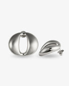 Sculptural oval open-center silver statement earrings with smooth polished finish
