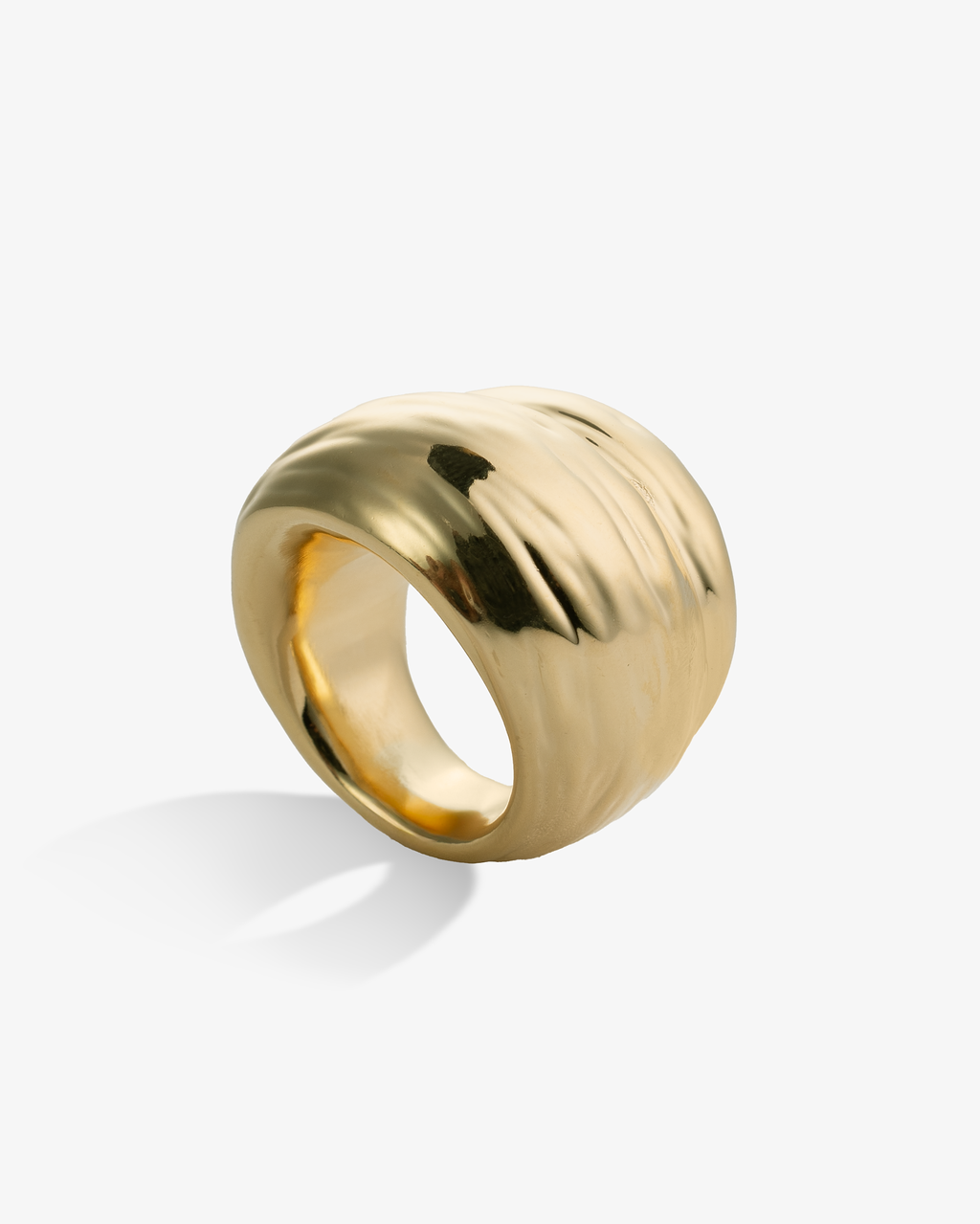 Polished chunky gold ring side view with curved sculptural design