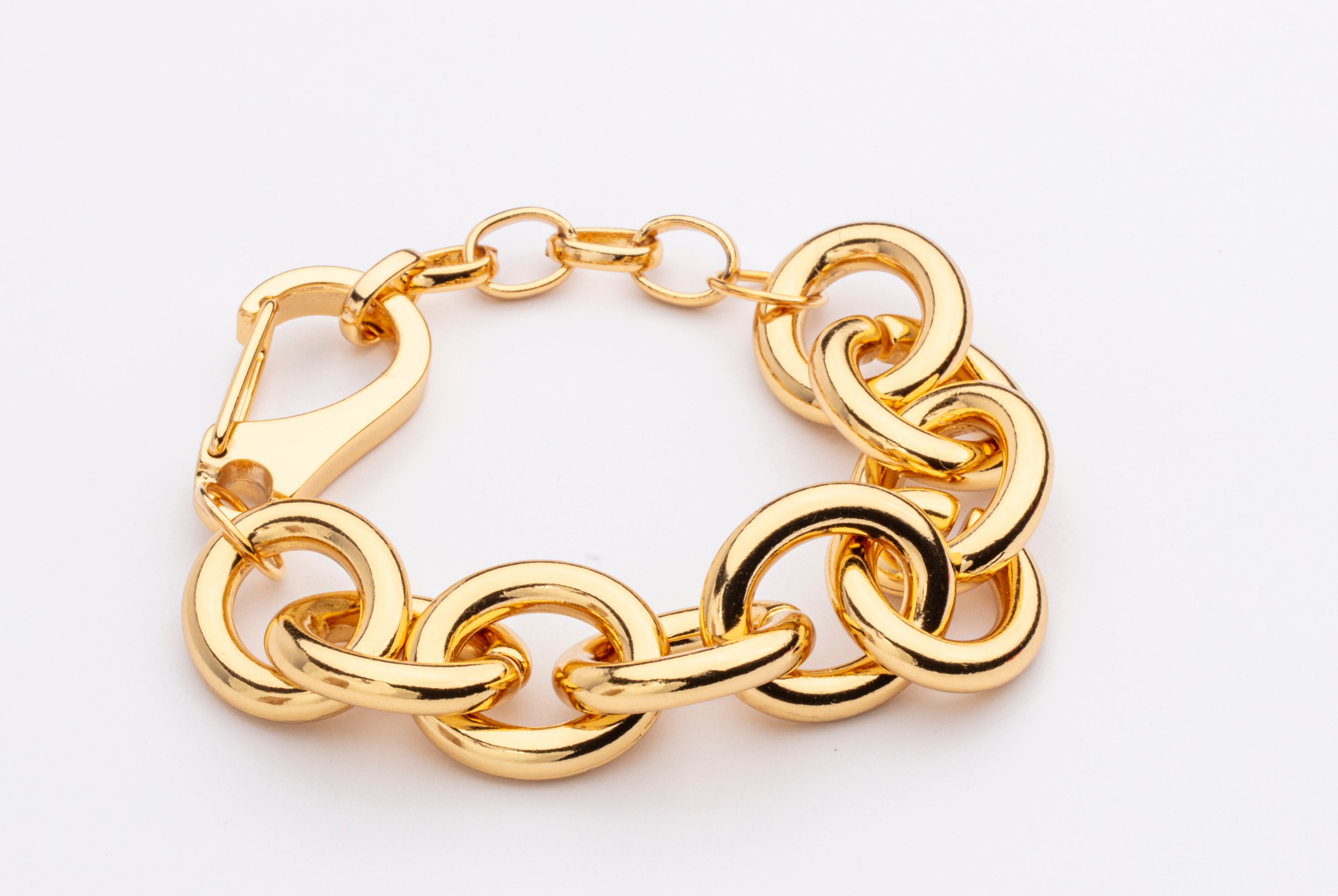 Gold plated chain link bracelet with bold interlocking links and polished finish