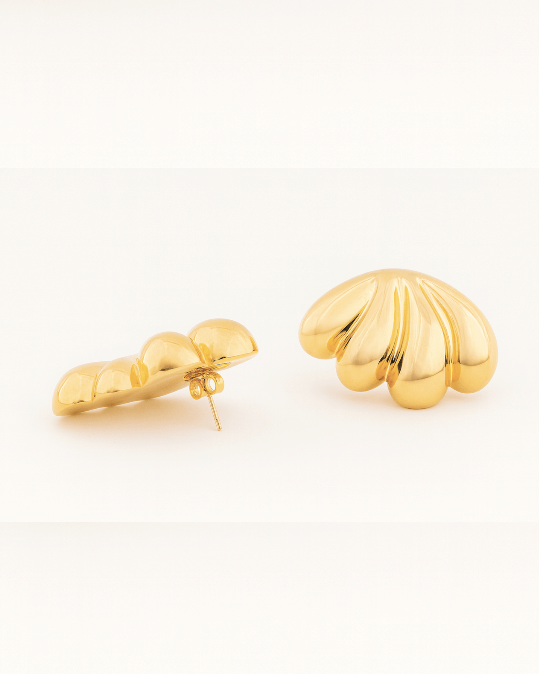 Gold plated fan-shaped earrings with layered radiating design and polished finish, 46mm by 30mm