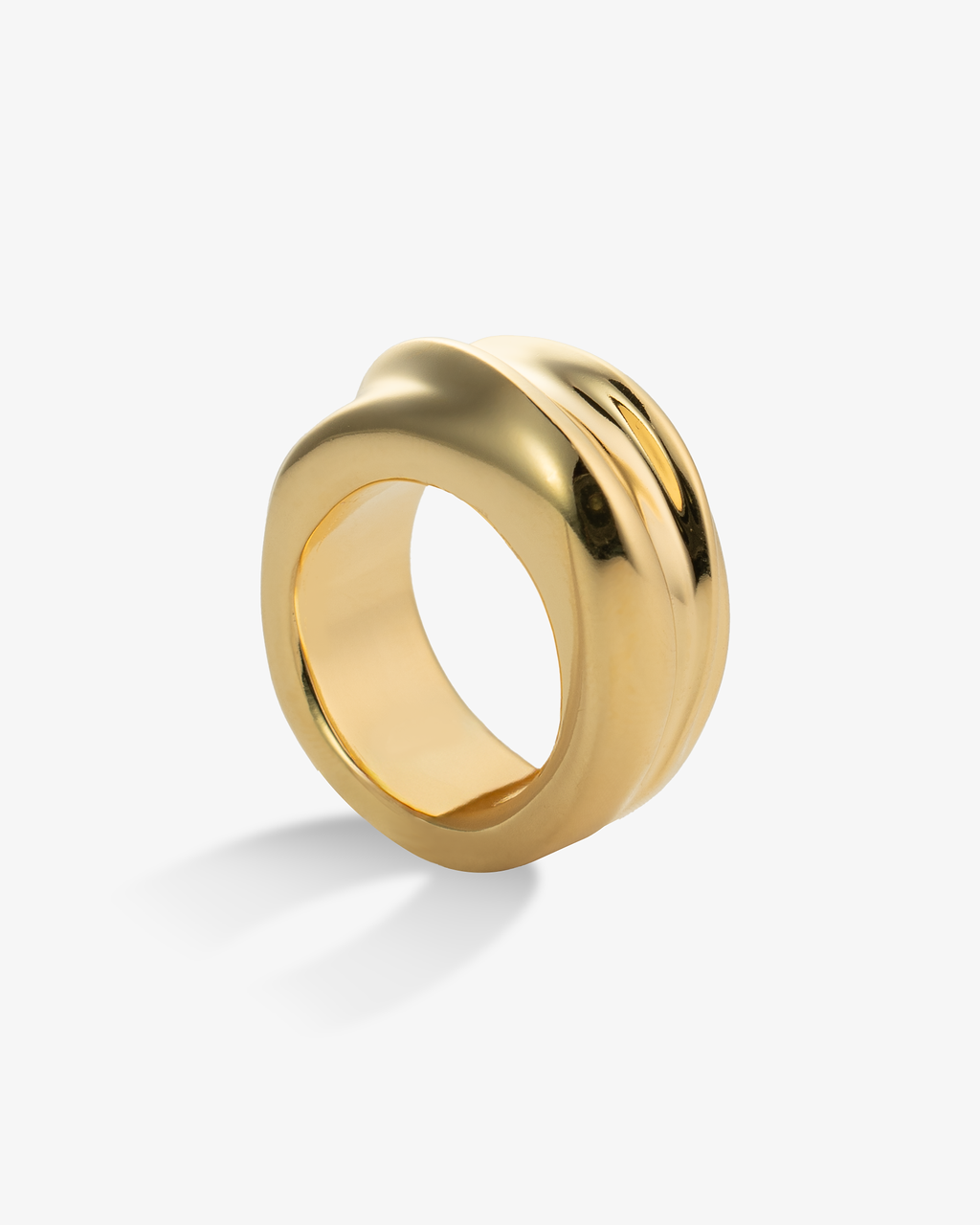 Gold chunky sculptural domed ring, alone product shot on a plain background.