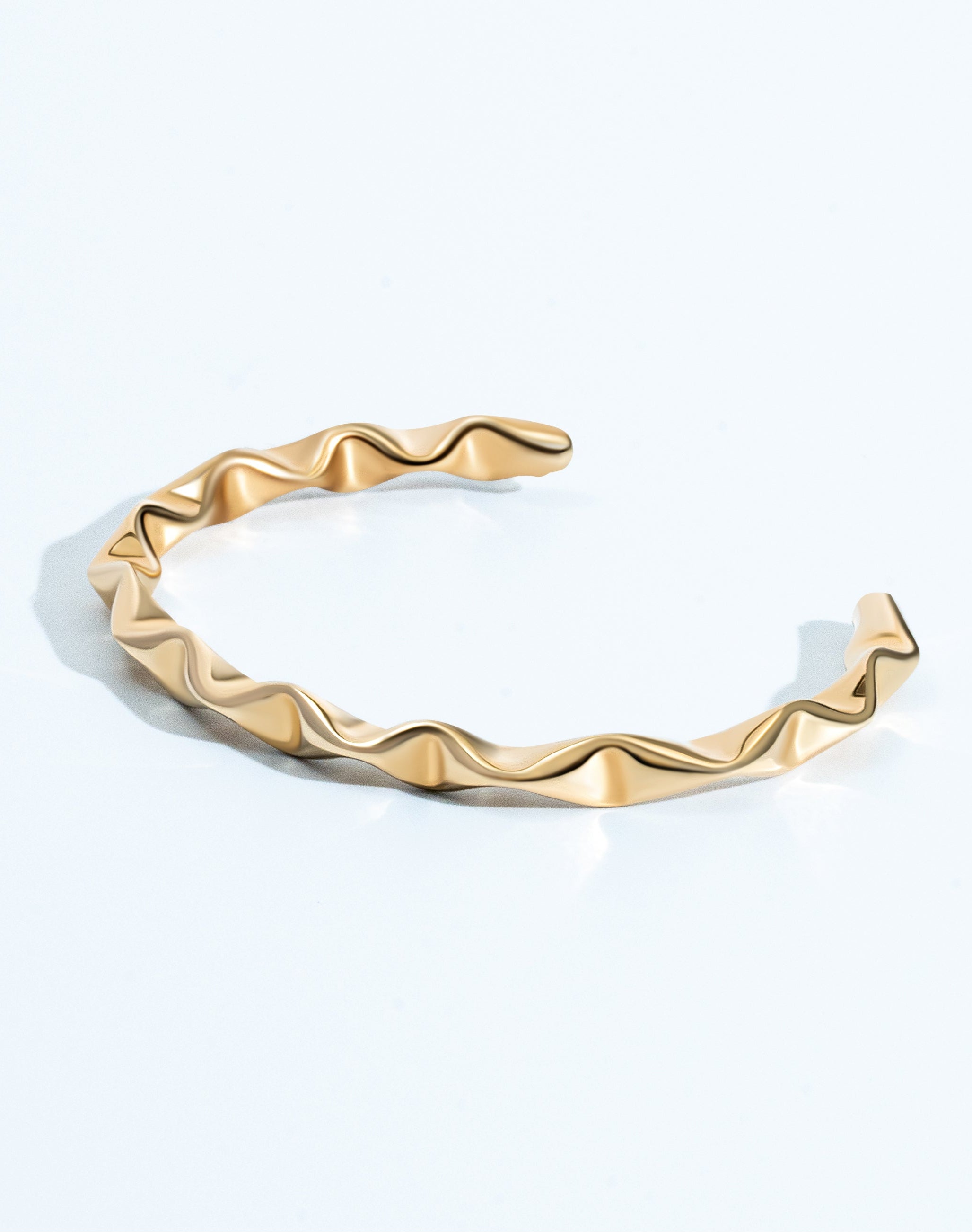 Gold geometric bangle bracelet with structured design and 4mm thickness