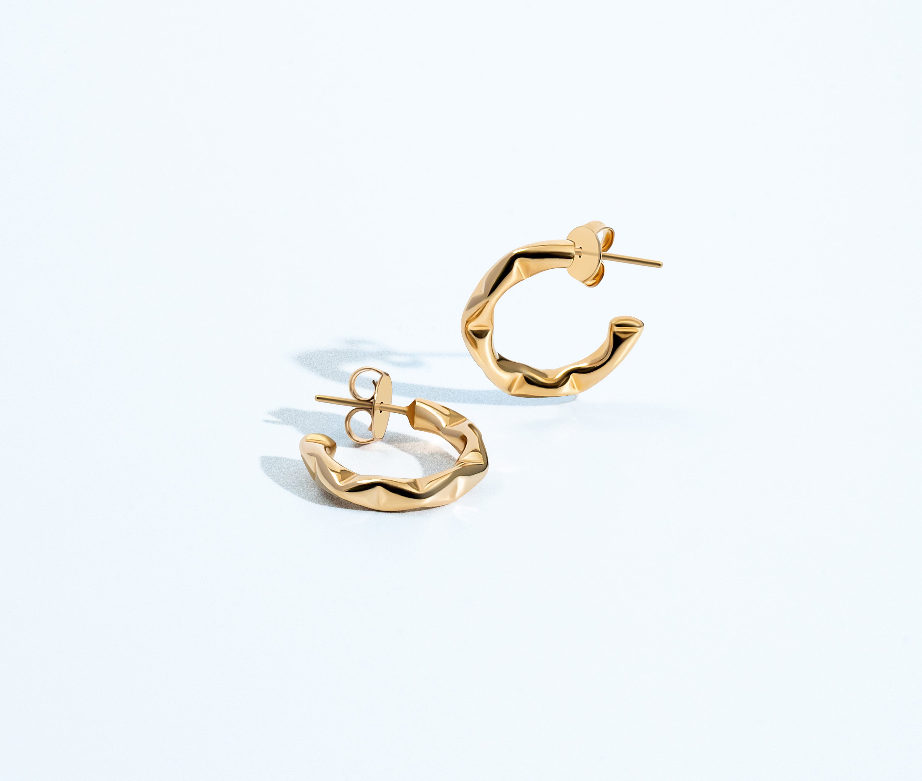 Gold geometric choker necklace with structured design and polished finish