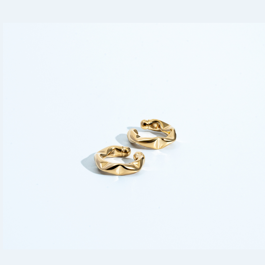 Gold twisted ear cuff with sculptural design, no piercing required