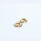 Gold twisted ear cuff with sculptural design, no piercing required