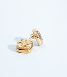 Square hammered earrings available in gold plated and rhodium plated finishes with geometric sculptural design