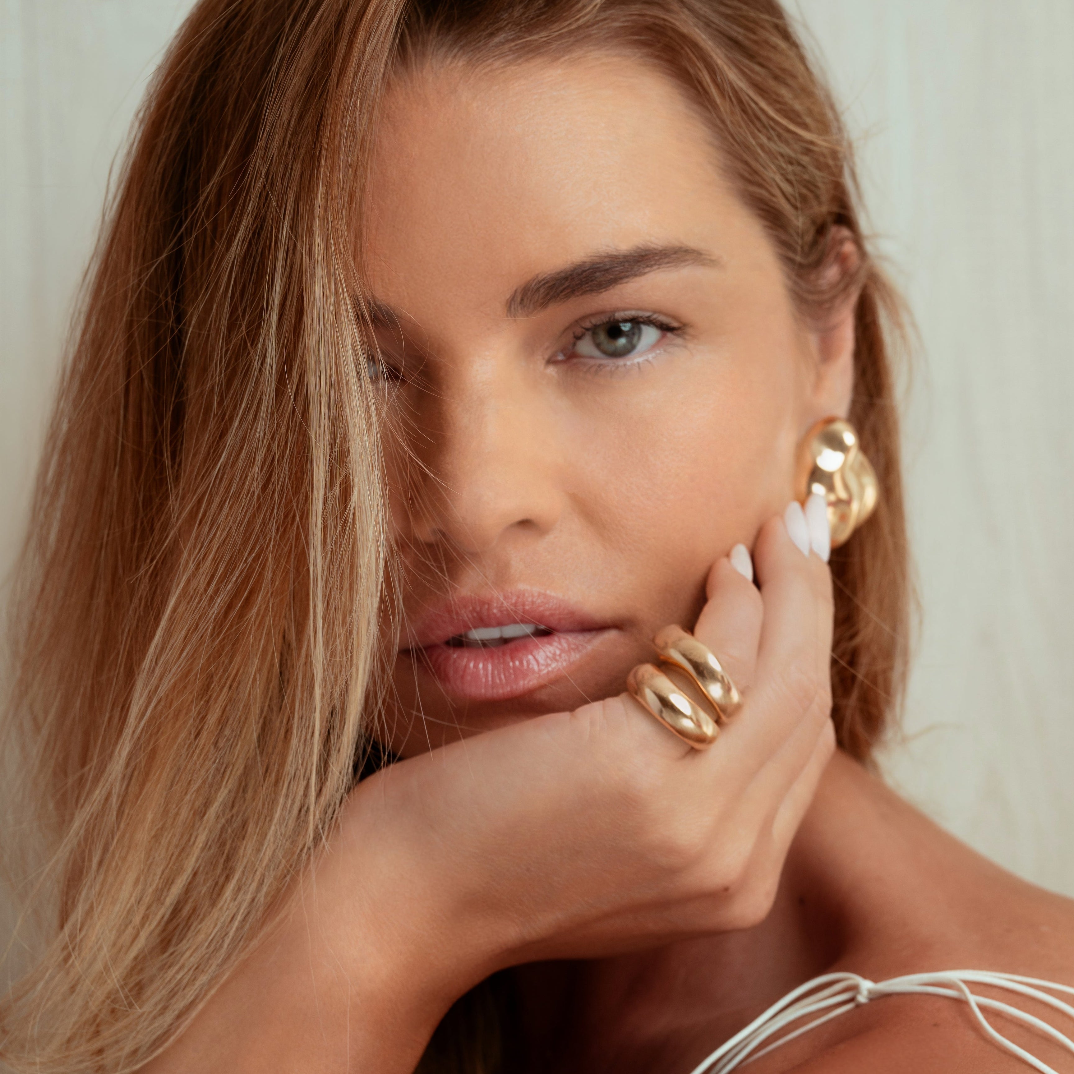 Gold rounded sculptural ring with chunky polished design