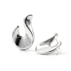 Abstract hook earrings available in gold plated and rhodium plated finishes with sculptural curved design