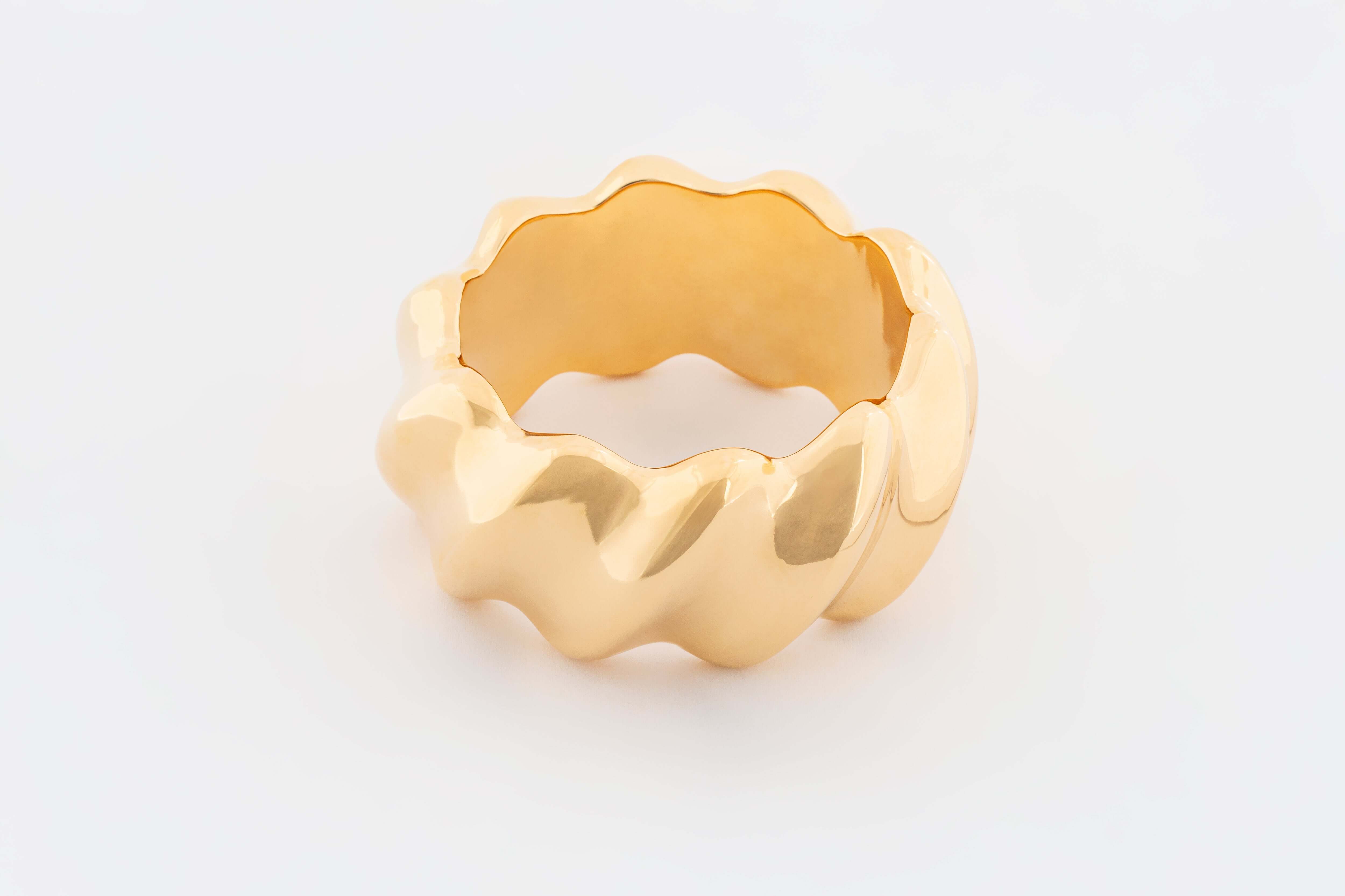 Gold plated wide structured bracelet with smooth continuous polished surface, 40mm