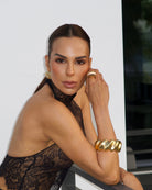 Organic Wavy Gold Statement Bangle Bracelet on a model
