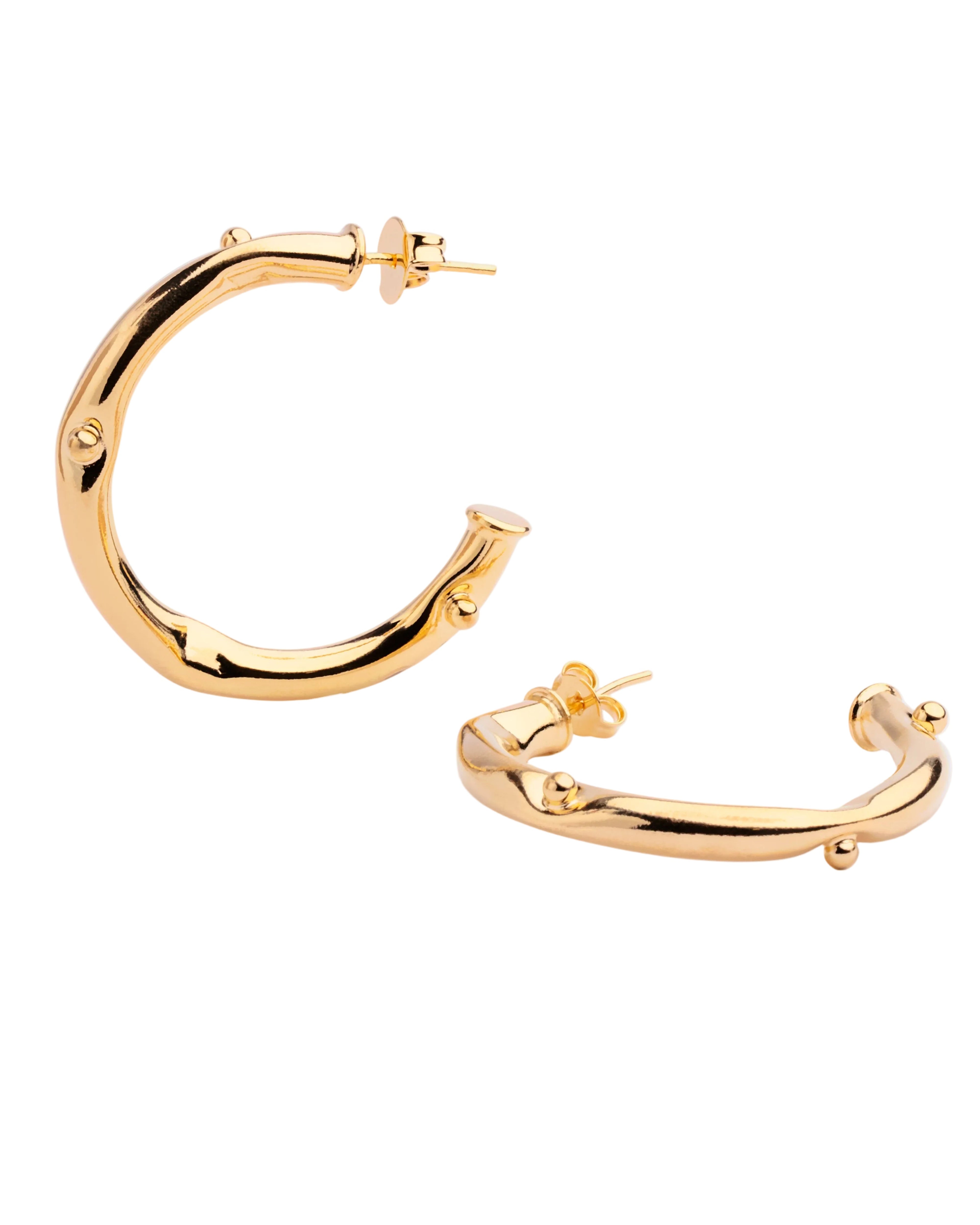 Gold plated open hoop earrings with continuous beaded texture and polished finish