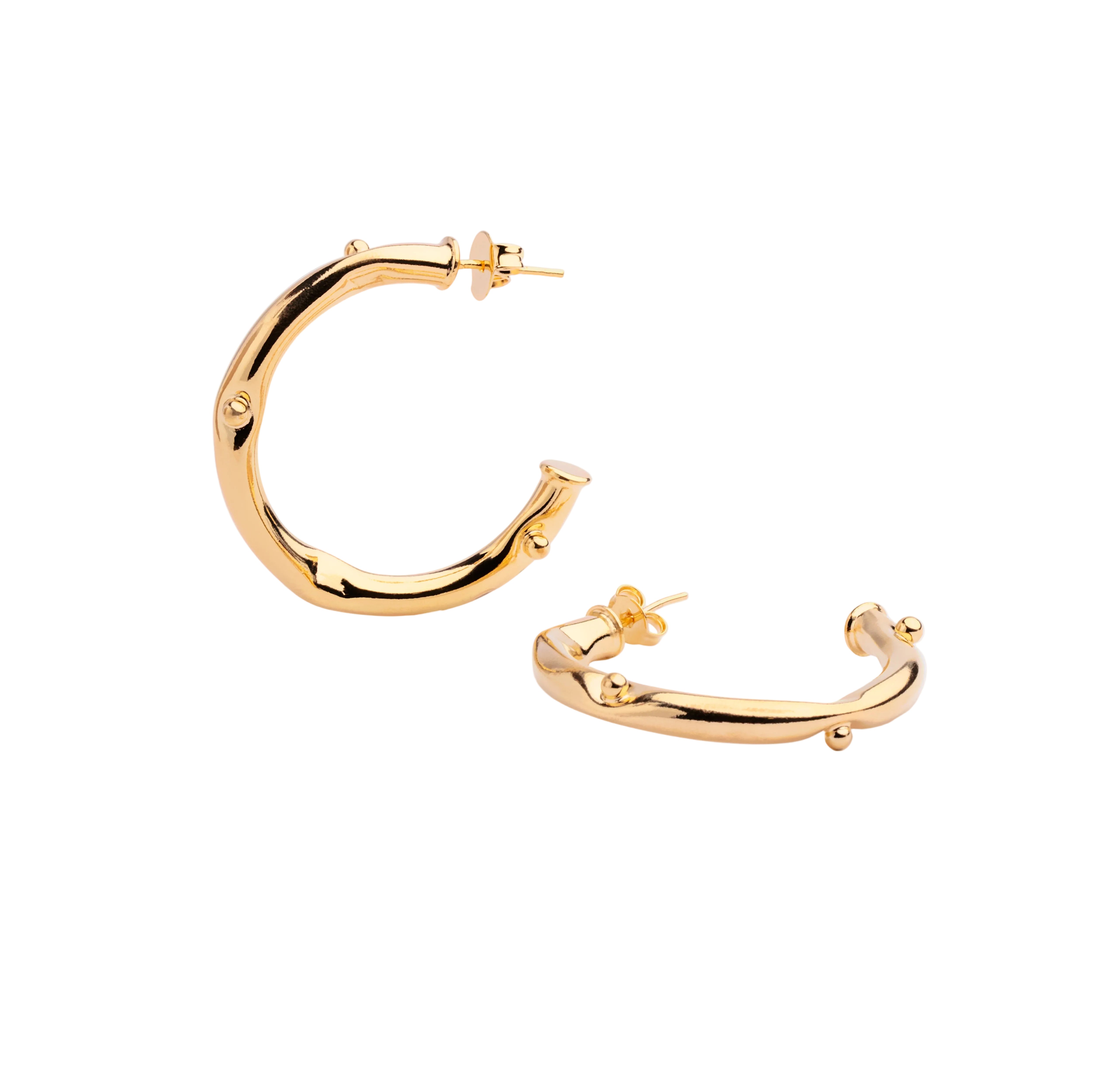 Gold plated open hoop earrings with continuous beaded texture and polished finish