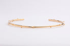 Bold gold plated bracelet with clean structured design and polished finish