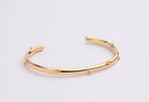 Gold plated bracelet with clean structured design and polished finish
